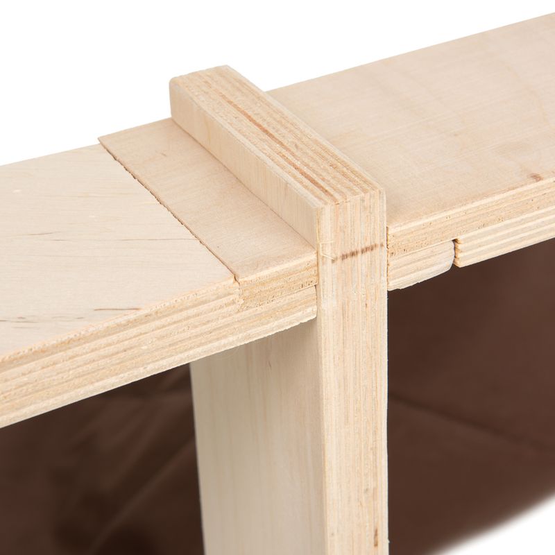 Close-up of a wooden structure with visible joints and smooth surface.