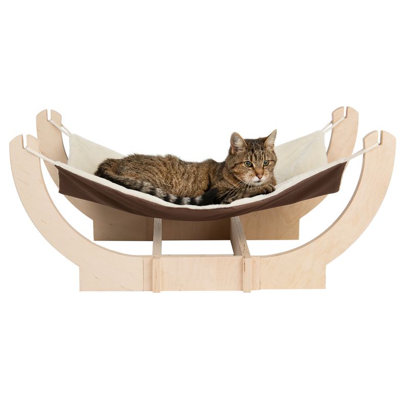 Wooden hammock with brown and white lying surface, a cat lying on it. Product for relaxation and rest for pets.