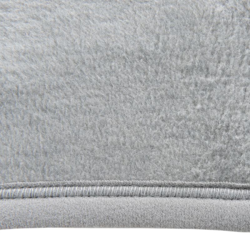 Close-up of grey fabric material with soft, fluffy texture and visible seam.