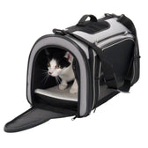 Transport bag with mesh windows and carrying strap, black-grey, open with a cat inside on a white cushion.