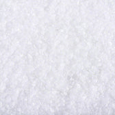 Close-up of white crystalline granules, showing product texture and consistency.