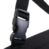 Close-up of a black plastic click fastener on a black webbing strap.