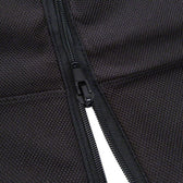 Close-up of a black zip on textured fabric, showing material details and workmanship.