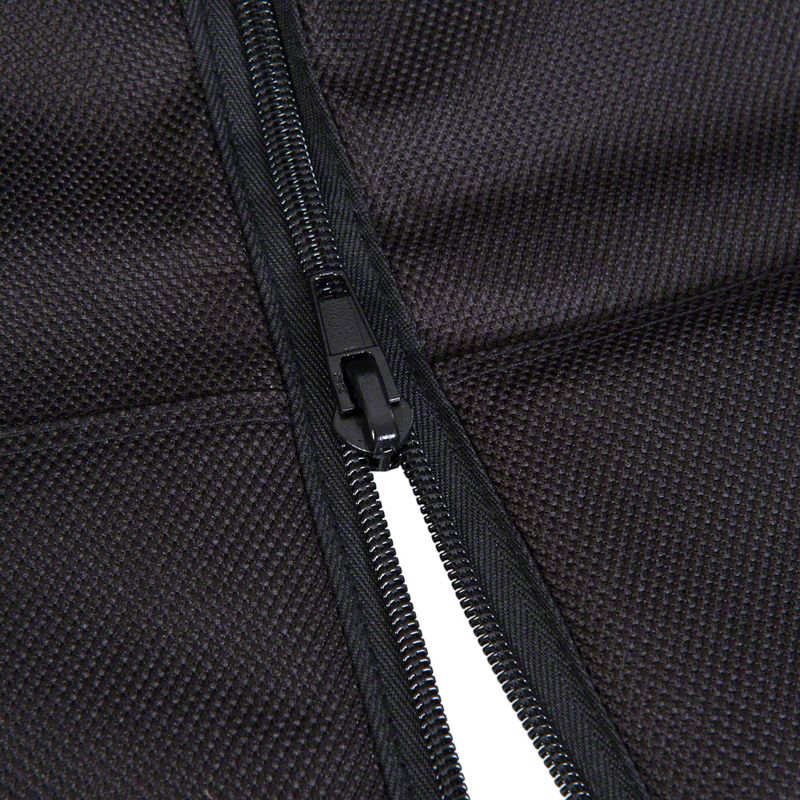 Close-up of a black zip on textured fabric, showing material details and workmanship.