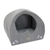 Grey, semi-circular pet bed with soft inner cushion and paw print design on the front.