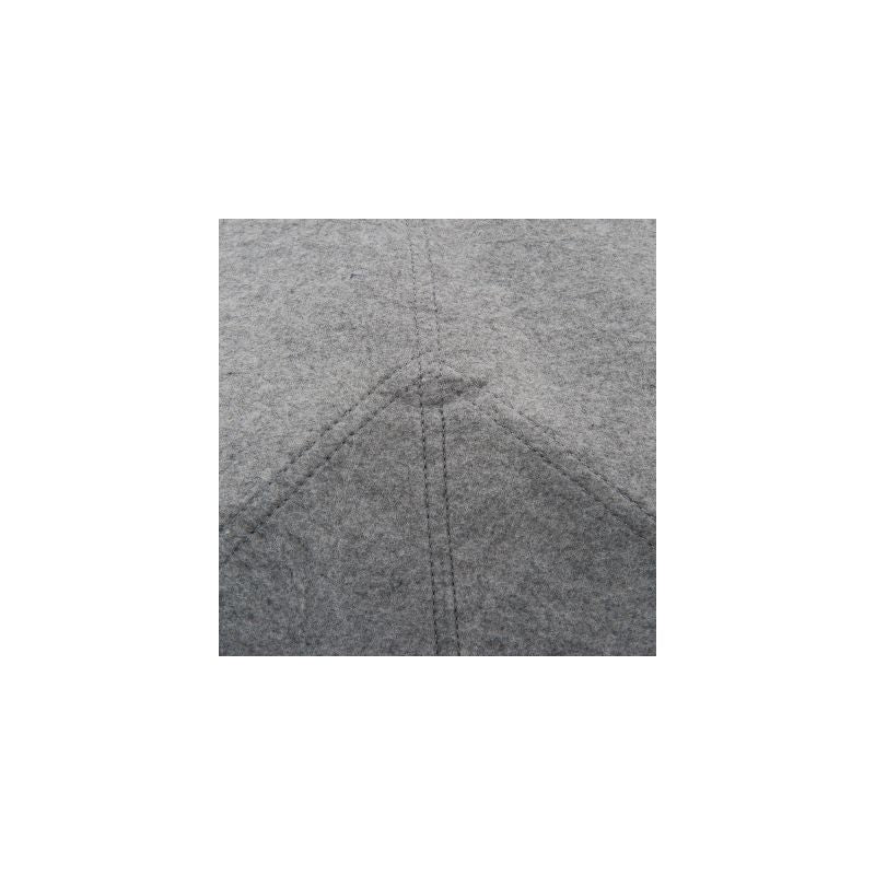 Close-up of grey felt material with visible seams, suitable for product description or material display.