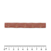 Red snack stick with grooves, length approx. 9 cm, centimetre scale visible.