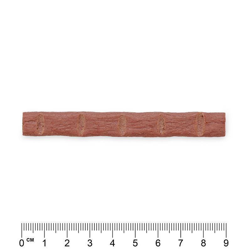 Red snack stick with grooves, length approx. 9 cm, centimetre scale visible.