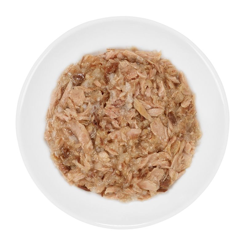 Bowl containing shredded wet food in gravy, showing texture and consistency for product evaluation.