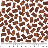 Close-up of brown snack pieces with centimetre scale, showing size and shape of the pieces.