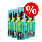 Multiple tubes labelled 'MINIS', 'CHICKEN', 'gently freeze-dried', and '100% pure meat' with a red percentage discount symbol, indicating a promotional offer on the product.
