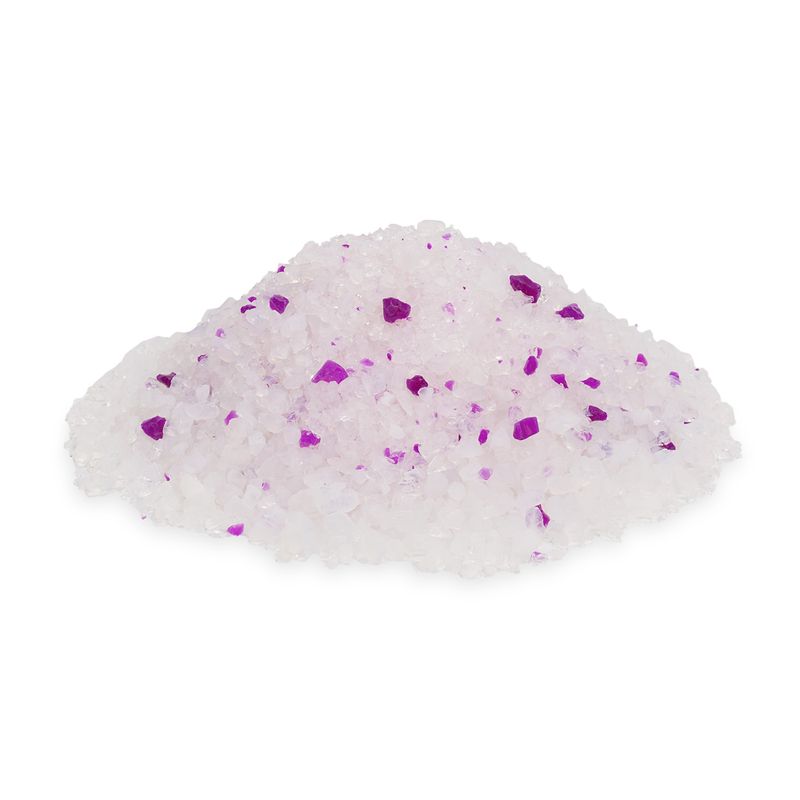 Pile of white crystals with occasional violet particles, possibly decorative or functional granules.